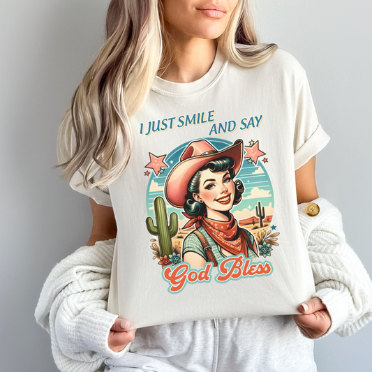 I JUST SMILE AND SAY GOD BLESS TEE - FANGIRL SWAG