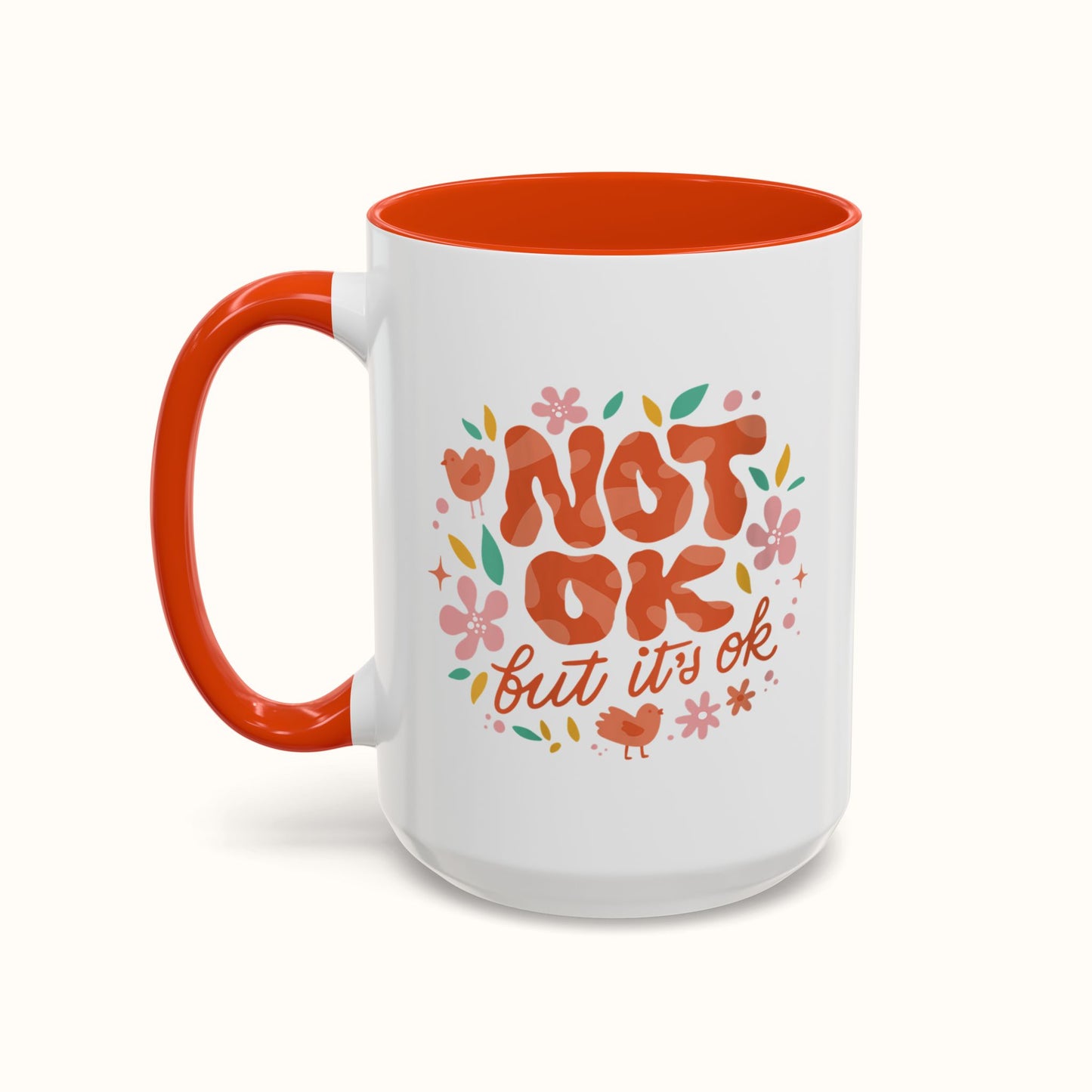 White mug with orange interior and handle, featuring colorful text and graphics on a white background