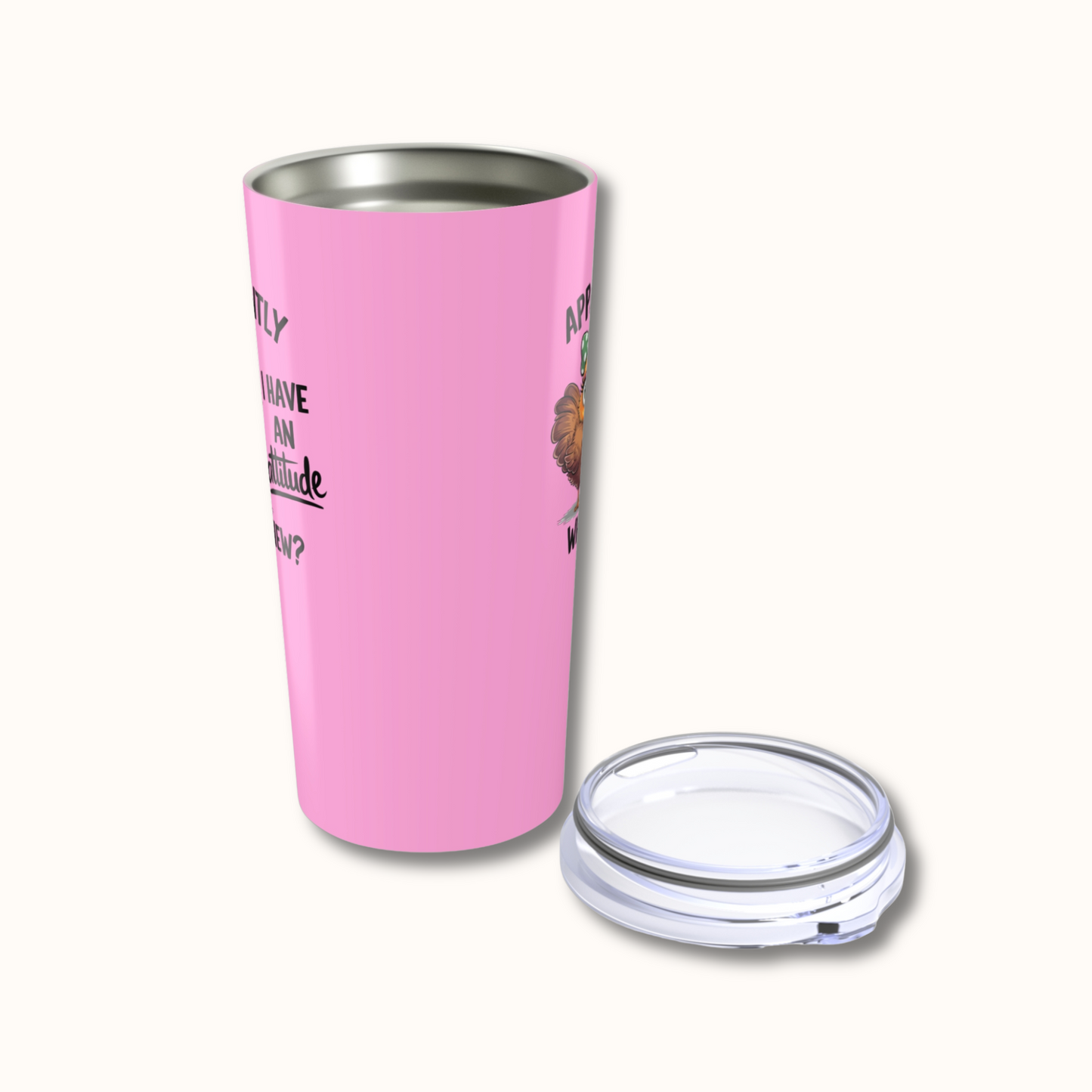 Pink insulated tumbler with a clear lid on a white background