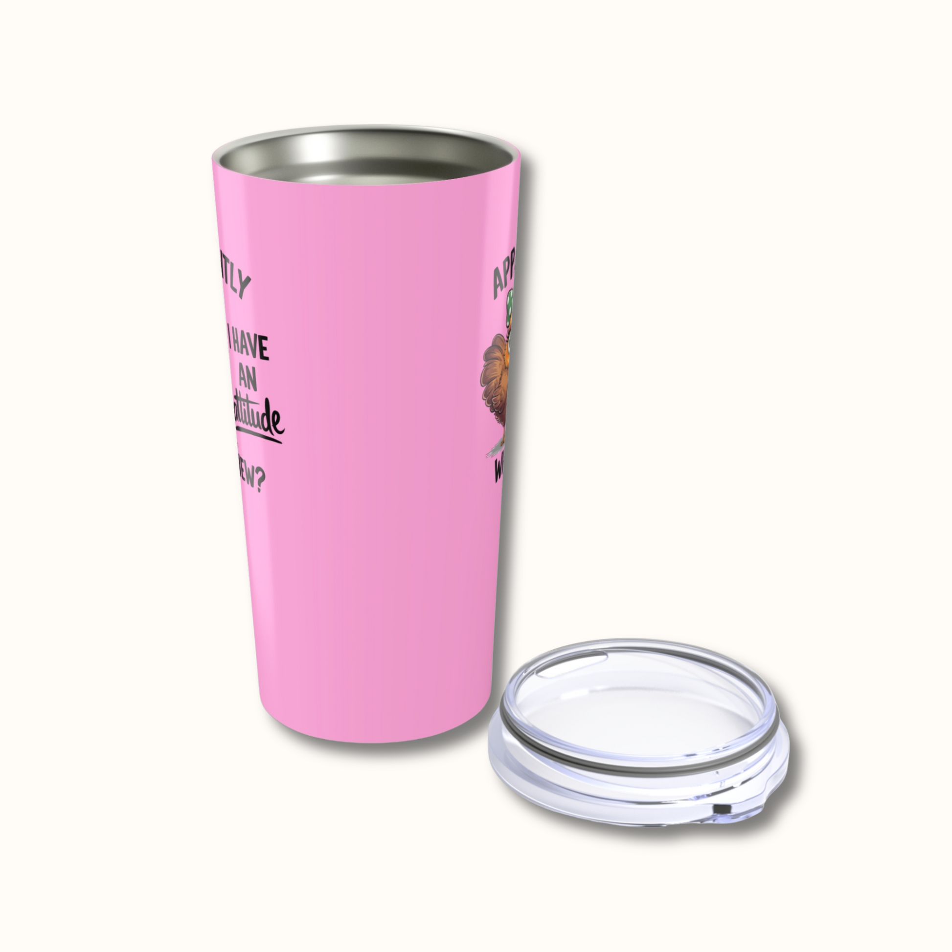 Pink insulated tumbler with a clear lid on a white background