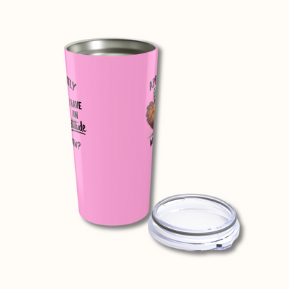 Pink insulated tumbler with a clear lid on a white background