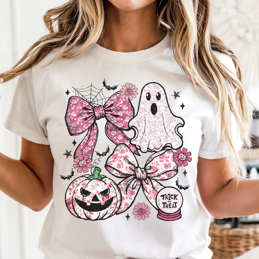 White t-shirt with Halloween-themed designs including bows, a ghost, and a pumpkin.