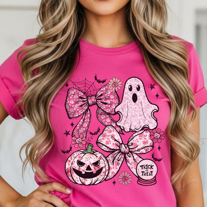 Person wearing a pink t-shirt with Halloween-themed graphics including ghosts, pumpkins, and bows.