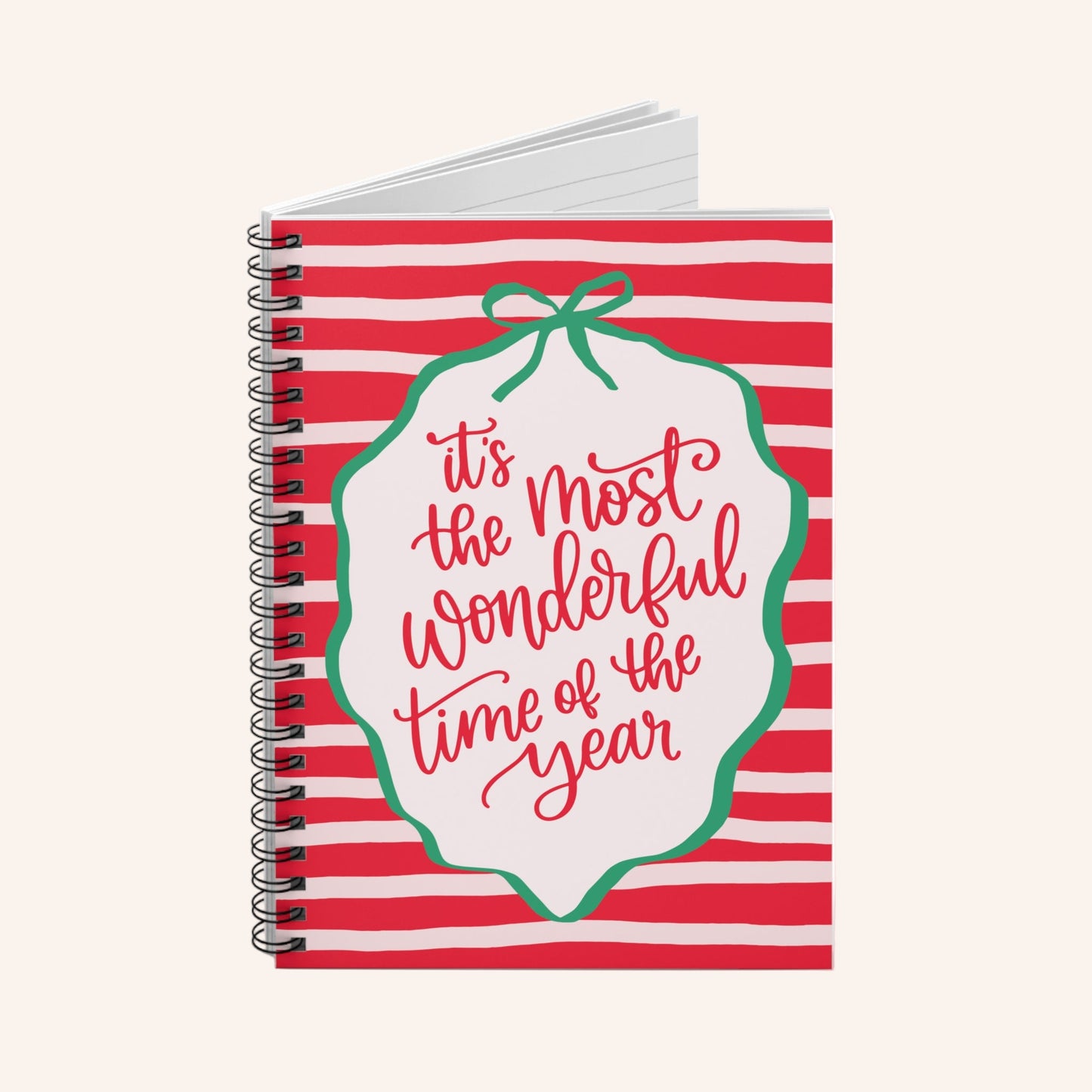 Notebook with red and white striped cover and 'it's the most wonderful time of the year' text.